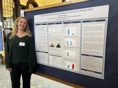 Photo of Emma with poster